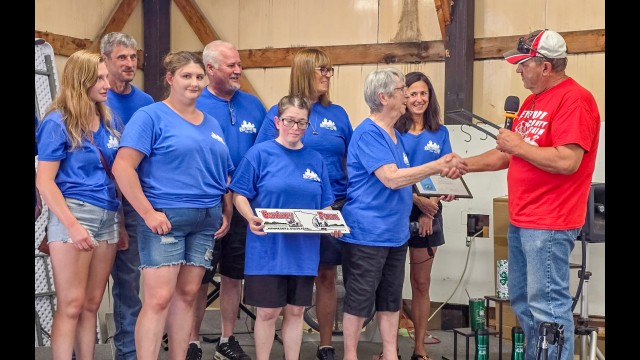 Theresa Spaeth, widow of Willard Spaeth, along with several family members, accepted the sign and certificate for the Wolfgang Spaeth Century Farm from a Farm Bureau representative during the Redwood County Fair on Sunday July 19, 2026. (Submitted photo)